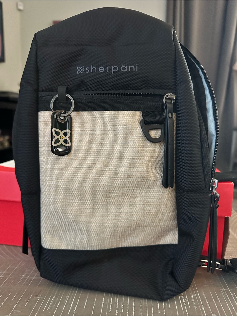 Sherpani Black and Cream Everyday Sling Backpack